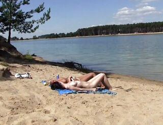 2 torrid russian young getting a suntan on the free beach. 2