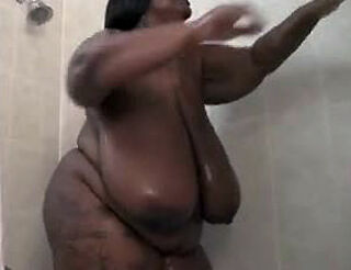 This Meaty ebony lady jerks in the shower. Her ginormous