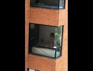 Hidden cam fuckfest vid filmed thru dormitory balcony window