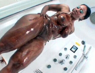 Bootylicious ebony chick covered in goopy chocolate sauce